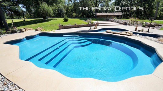 Thursday pools' side view California Pearl Pool with stair entry, tanning ledge, and bench seating