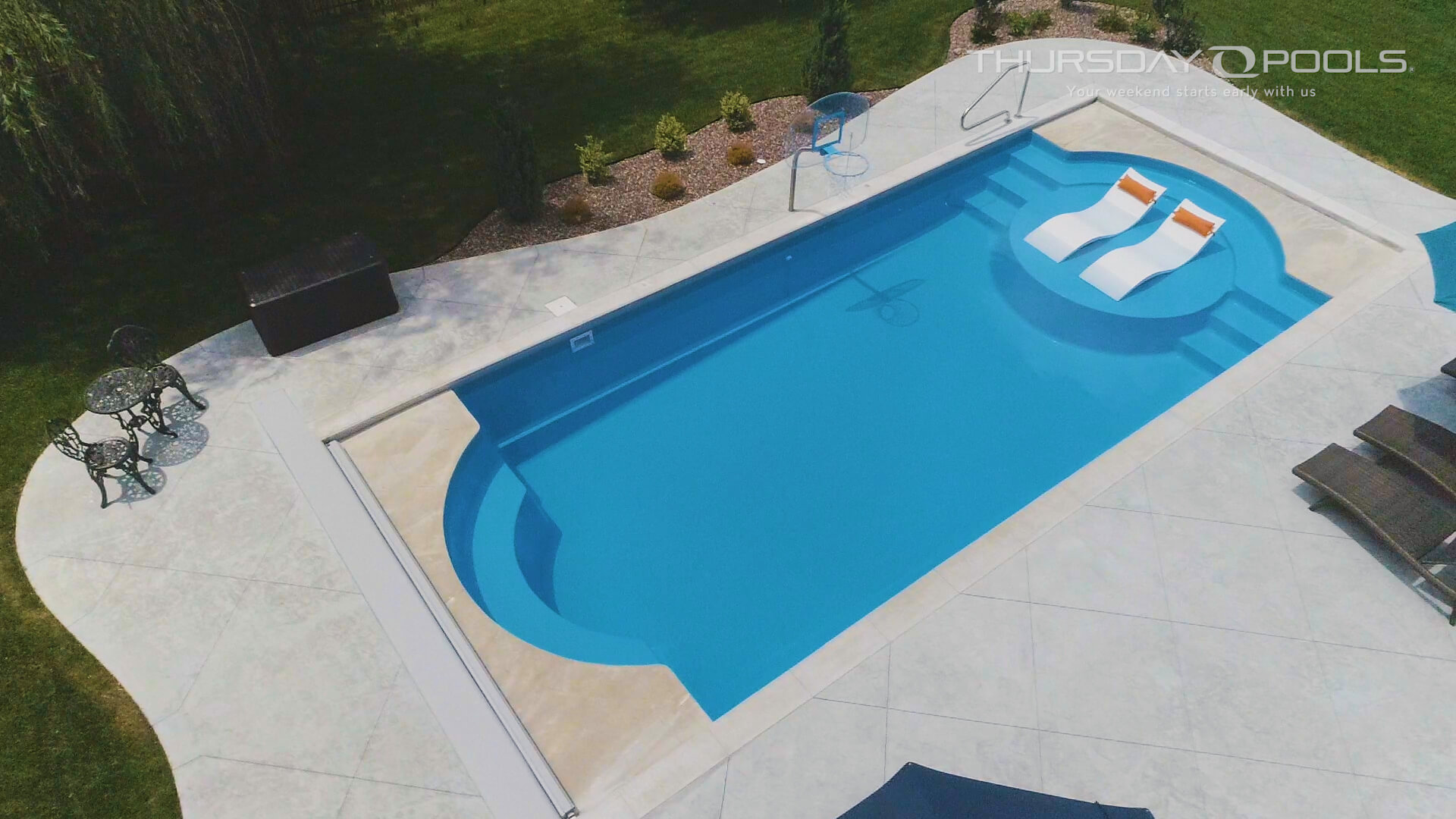 Thursday Pools overhead view of Cathedral LX pool with white lounge chairs