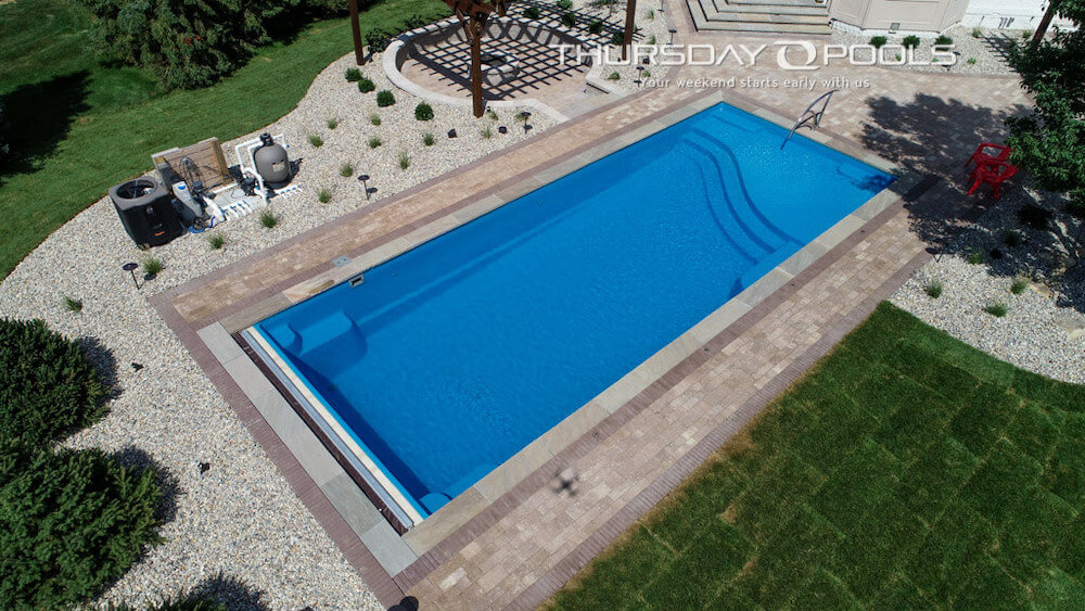 Thursday Pools California Aspen pool with decorative tile patio