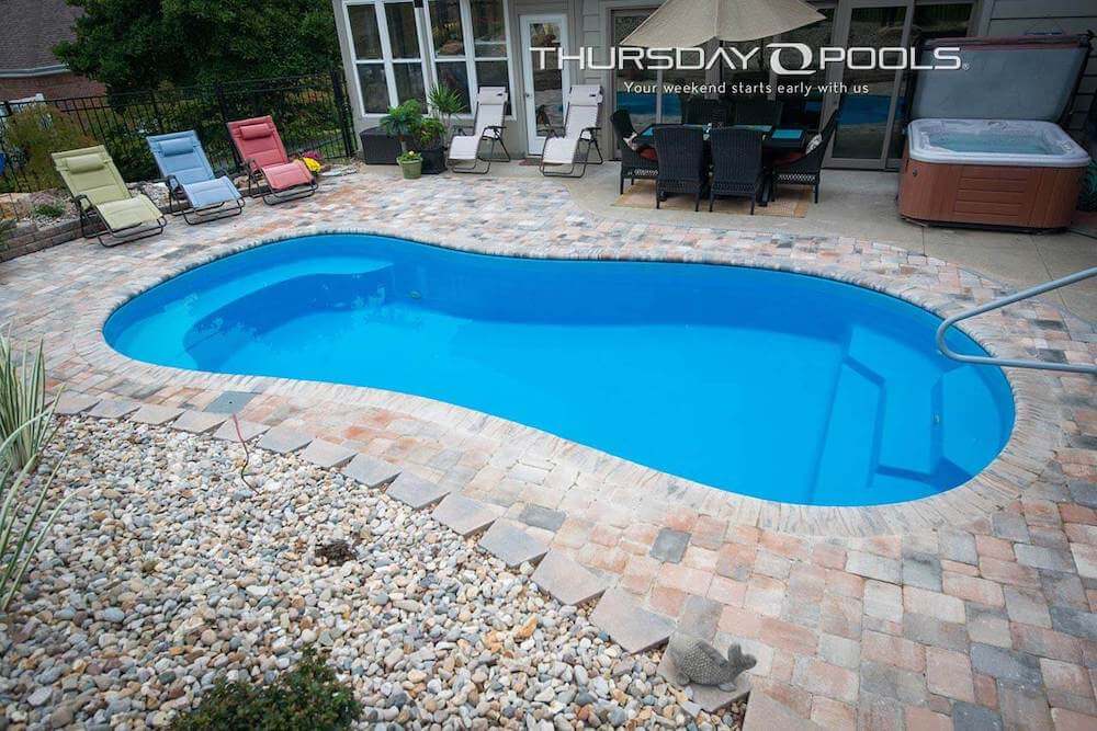 Thursday Pools Titus pool in Jasper with tile patio