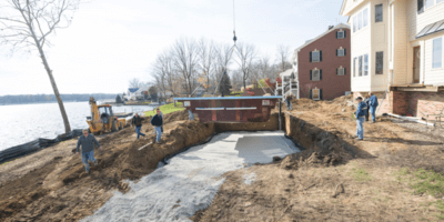 Thursday Pools photo of workers installing pool