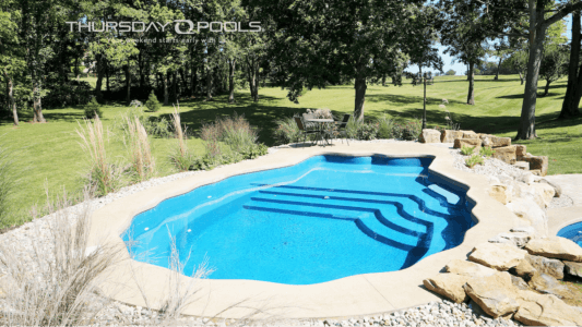 Thursday Pools Pearl Pool with landscaping surrounding pool