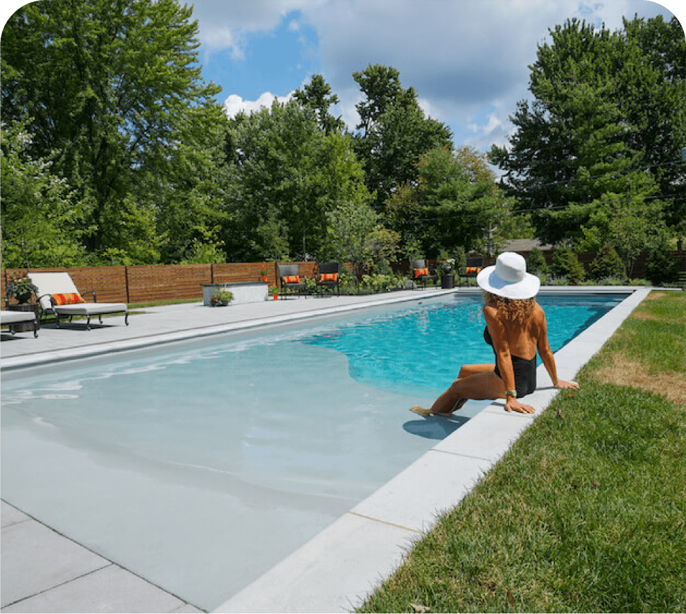 Thursday Pools women sitting on edge of Grace Beach Entry Pool