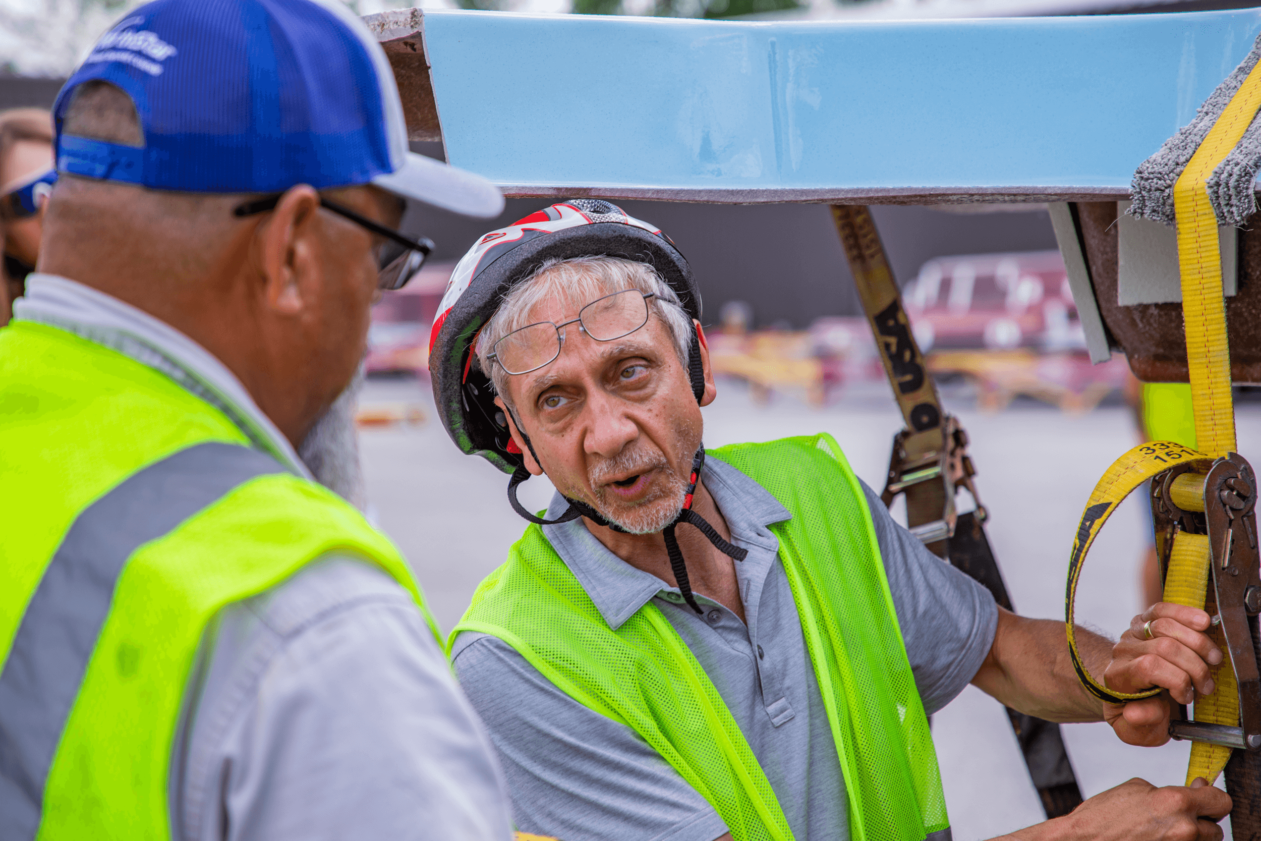 Thursday Pools' 2 guys talking while working during a manufacturing shoot.