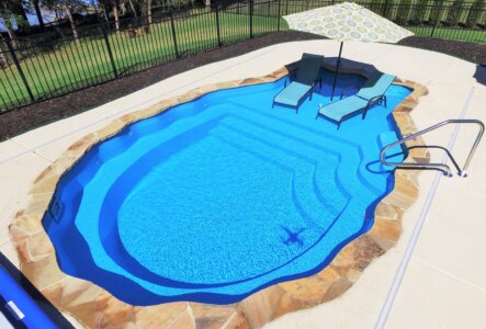 Thursday Pools pearl pool with decorative hardscaping border