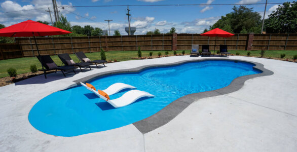 Thursday Pools Sandel Beach Entry with two lounge chairs in pool