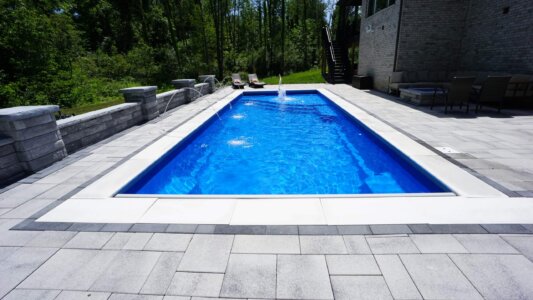 Thursday Pools Maya Fiberglass pool with Hendricks Pavers
