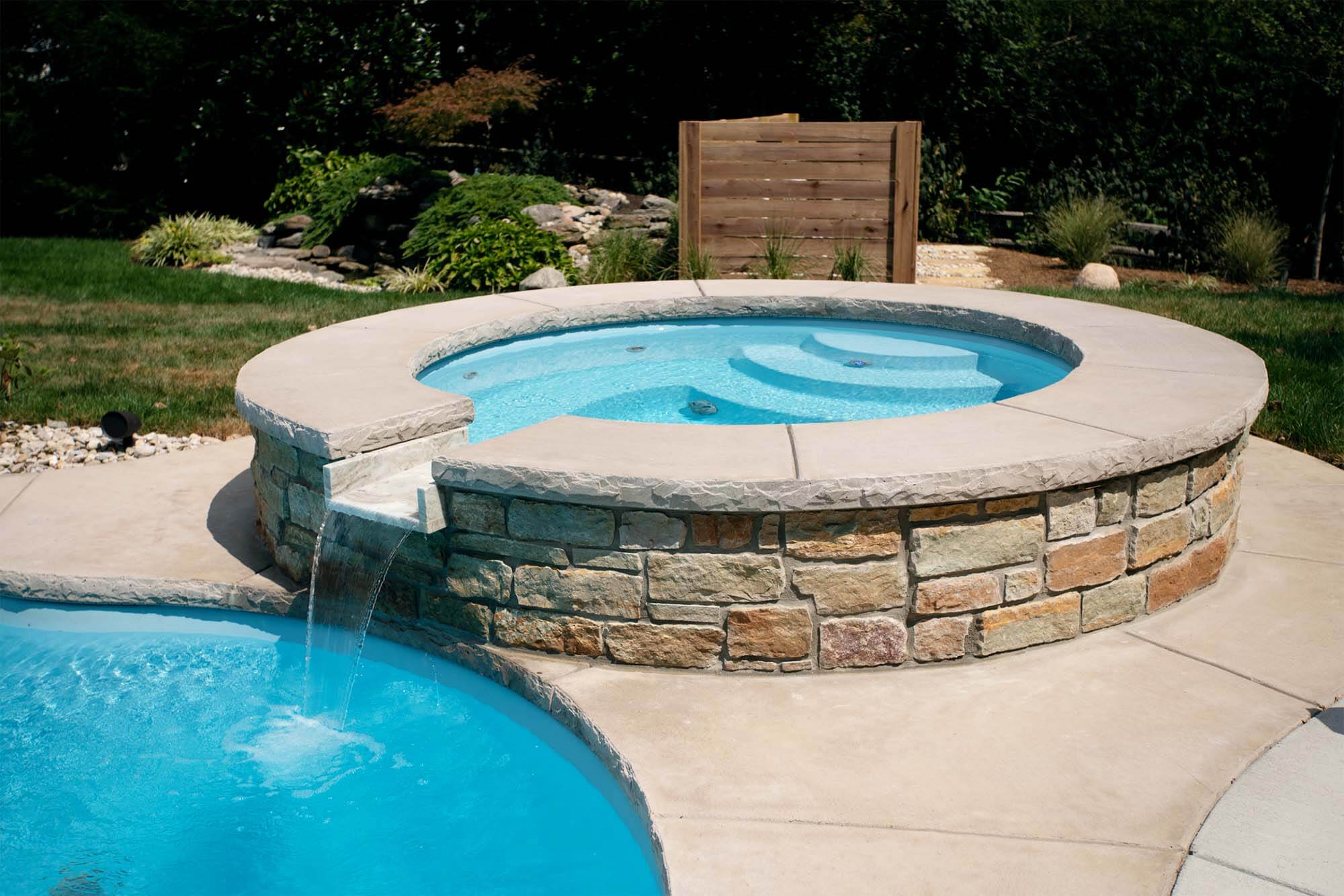 Round Spa with Spillway by Thursday Pools