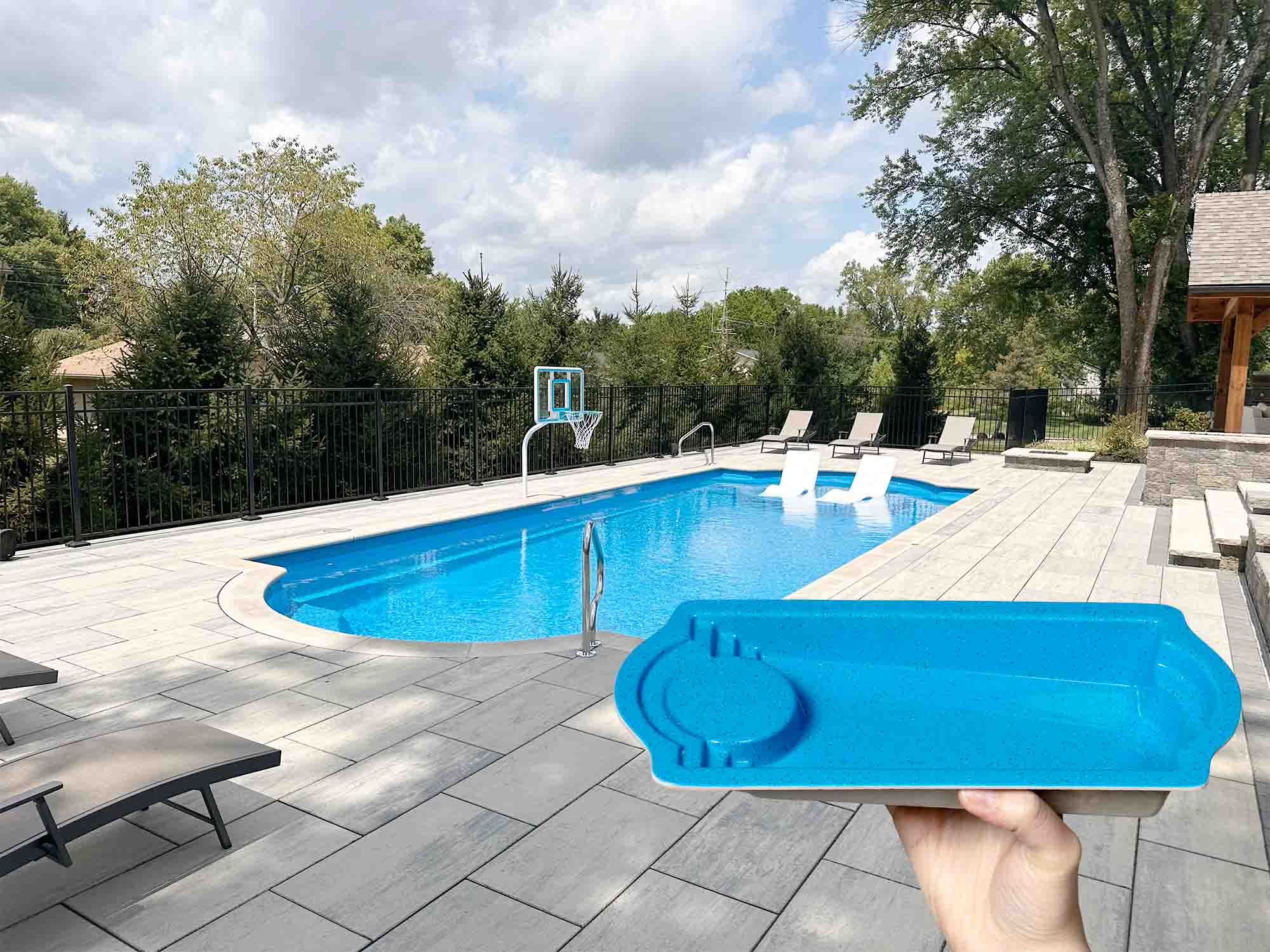 Cathedral LX pocket pool in front of an installed Cathedral LX pool by Thursday Pools