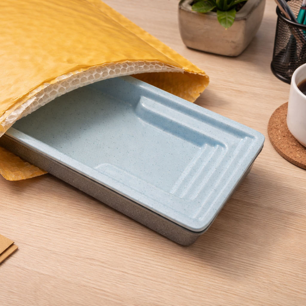 pocket sized pool model in a bubble mailer envelope